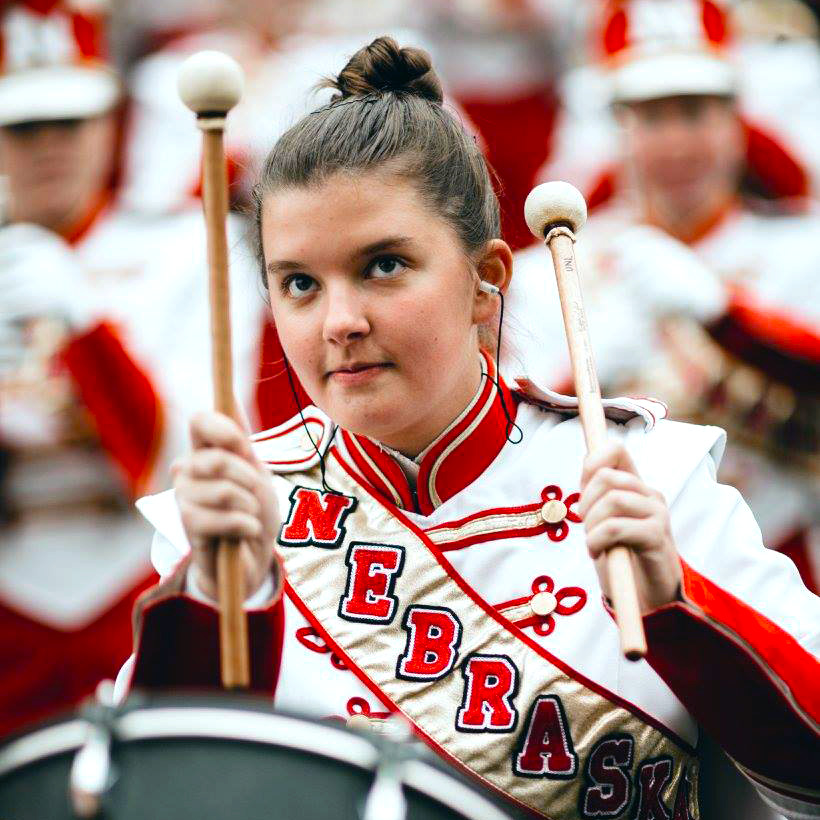 Alyssa playing percussion in marching band