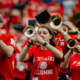 Alumni band members playing trumpet